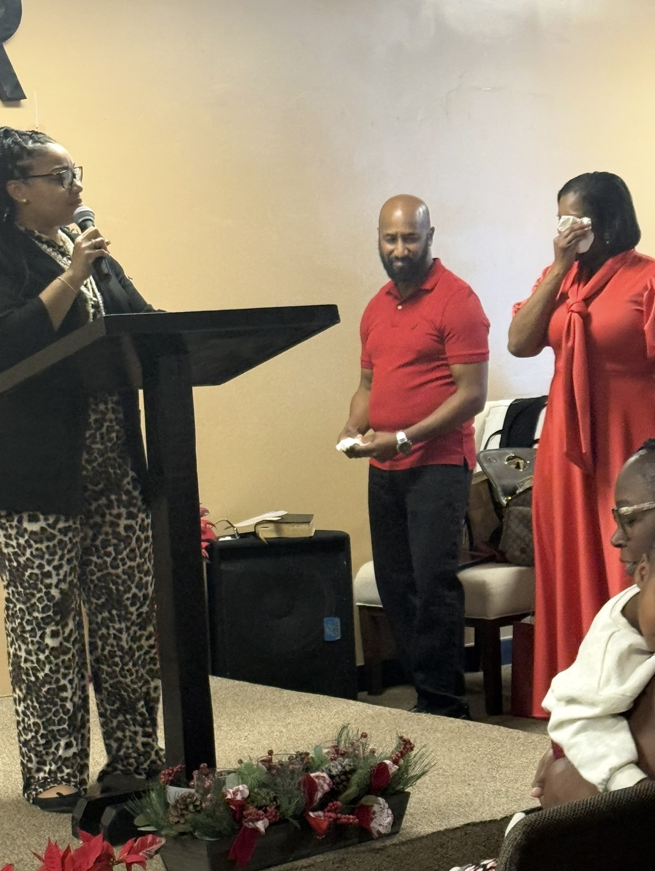 Church members sharing an emotional ministry milestone