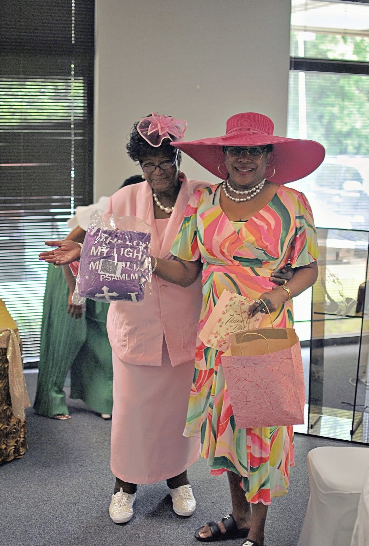 Two women celebrating together at a church gathering
