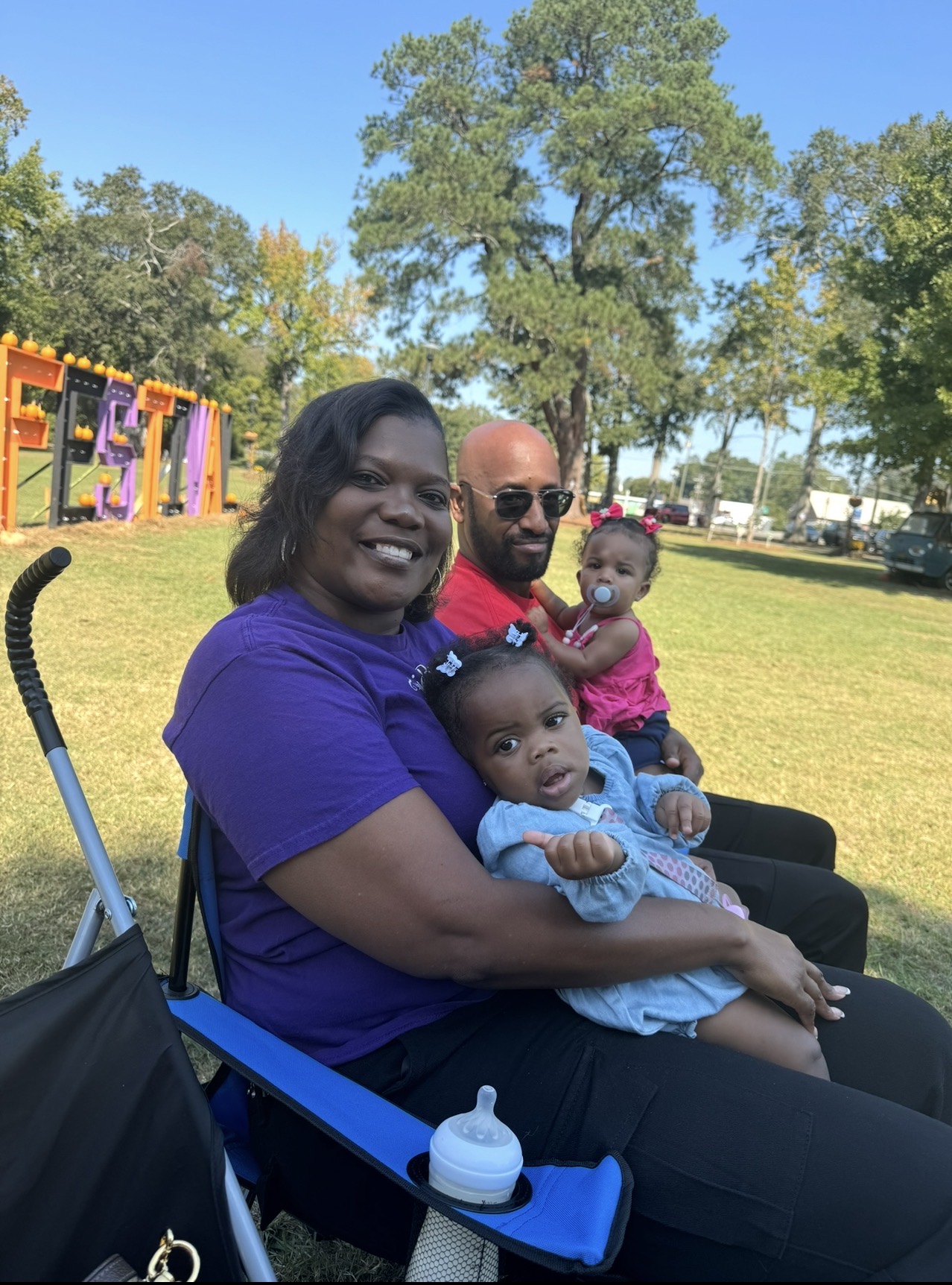 A family enjoying a community event outdoors