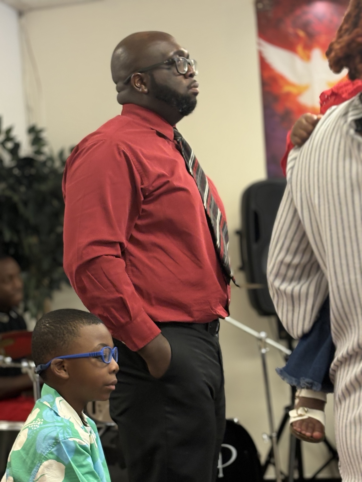 An adult and child together during worship