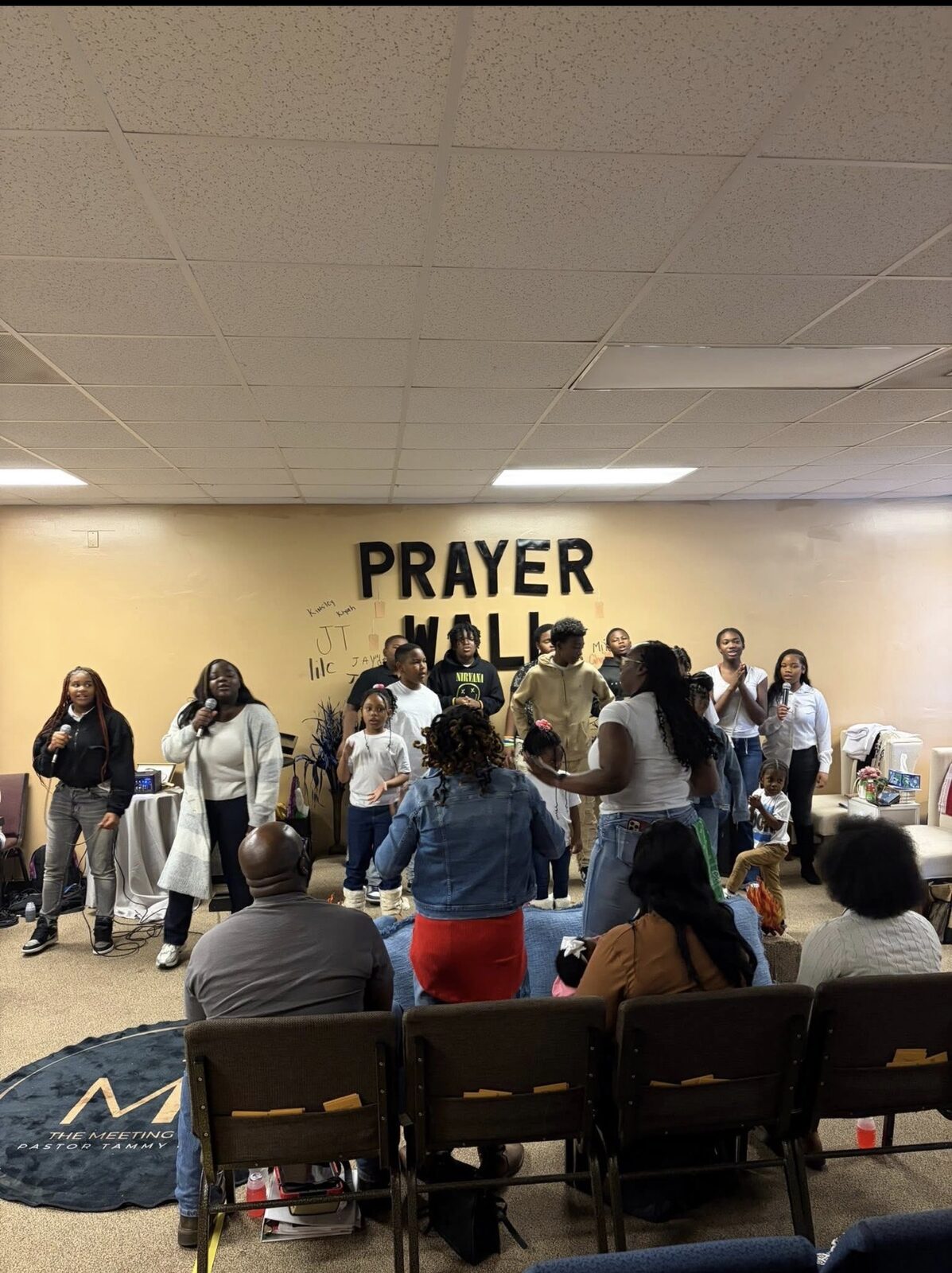 Youth and families worshipping together